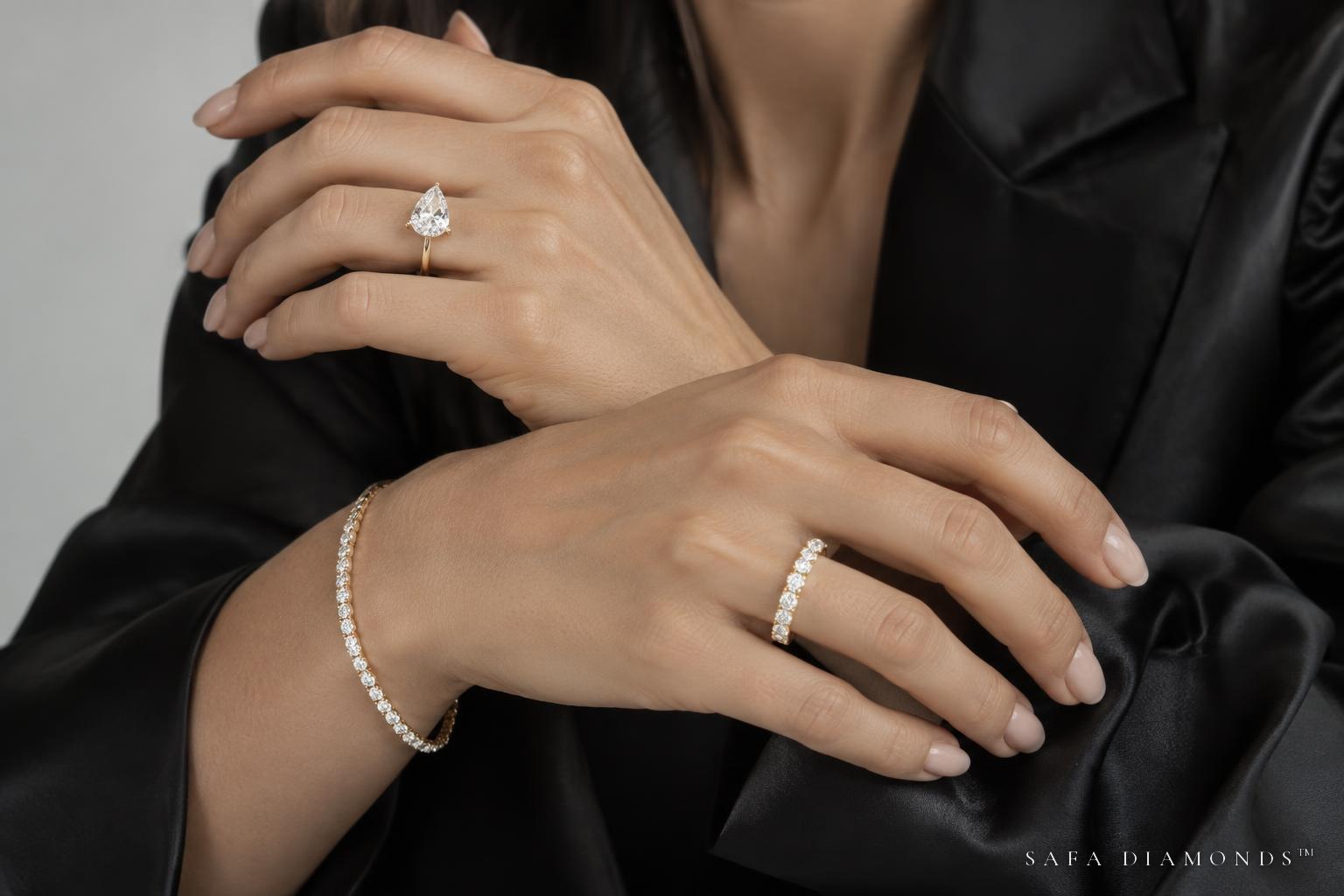 Diamond rings and a tennis bracelet styled with black silk